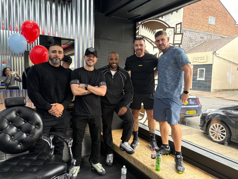 Five of the Grimbarber team lined up in the shop window on opening day